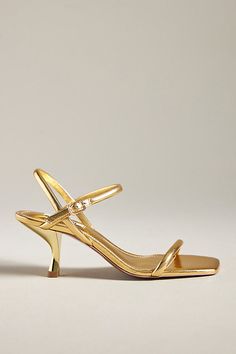 Leather upper, insole Rubber sole Plastic kitten heel Buckle styling Imported | Simple Strappy Kitten Heels by Bibi Lou in Gold, Women's, Size: 36, Leather/Plastic/Rubber at Anthropologie Gold Sling Back Heels, Styling Kitten Heels, Gold Chic Kitten Heels With Ankle Strap, Formal Kitten Heels, Gold Low Heels, Short Gold Heels, Chic Gold Kitten Heels, Elegant Gold Fitted Kitten Heels, Luxury Gold Kitten Heels