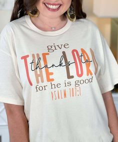 a woman wearing a t - shirt that says give the lord for he is good