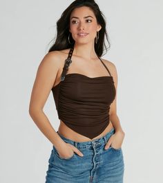 Perfect for festivals, concerts, or nights out with friends, this statement halter top brings the Wild West anywhere you go. It features a faux leather adjustable belted halter strap with buckle closure, western metal trim, side ruched seams that define your curves, and a fitted crop hem soft lined knit fabric. Complete the look in trendy denim shorts and boots.Fit & FeaturesSoft-lined knit stretchy fabricFaux leather adjustable halter strap, buckle closureWester metal trimSide ruched seamsF Chic Brown Halter Top For Night Out, Trendy Fitted Halter Top For Festival, Trendy Fitted Halter Top For Music Festival, Halter Neck Top For Music Festival, Trendy Club Halter Top, Fitted Brown Halter Top For Festivals, Trendy Halter Neck Crop Top With Adjustable Straps, Festival Halter Top With Adjustable Straps, Denim Shorts And Boots