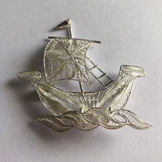 "Silver Ship Brooch Barco Light - Ship Jewelry - Transportation Jewelry - Handmade Silver Jewelry - Silver Art - Pirate Jewelry - Gift Idea Filigree - delicate jewellery technique made from silver or golden threads \"embroidering\" kind of metalwork lace that is specific to Spain, especially an Andalusian town Cordoba, where they call it a cordobese filigree. This craftsmanship has been passed from generation to generation, nonetheless nowadays there are very few craftsmen left who know to perfo Handmade Artisan Silver Brooches, Handmade Artistic Silver Brooch, Pirate Jewelry, Delicate Jewellery, Antique Silver Jewelry, Handmade Silver Jewelry, Jewelry Techniques, Silver Jewelry Handmade, Silver Art