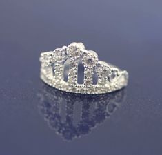 This Beautiful and Sweet Crown Ring With Cz, its made with high quality Sterling Silver 925 Its perfect for anyone any age for any occasions, a great gift for that special someone or yourself. Item Specifications: Item: PACOR4 Metal Type: Sterling Silver Metal Stamp:925 Style: Ring Style: Crown Stone: Multiple CZ Ring Height : 1/2 inch ( approx 13mm) * We only sell SOLID metals Stamp: 925 Sterling Silver. We do NOT Silver plate our Jewelry More Woman Ring: https://www.etsy.com/shop/Alyssasdreams Silver Rings With Prong Setting For Birthday, Elegant Rings With Diamond Accents For Birthday, Elegant Diamond Ring For Birthday, Wedding Diamond Ring With Sparkling Stones, Elegant Diamond Birthday Rings, Elegant Silver Rings For Birthday, Wedding Diamond Ring With Sparkling Stones In Sterling Silver, Sterling Silver Crown Shaped Elegant Rings, Silver Ring With Crown Design