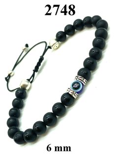 The evil eye is believed to ward off negative energy and offer protection. wear this eye as a symbol of protection against bed luck. Black Onyx Bracelet, Stretch Band, Onyx Bracelet, Stretch Bands, Lava Rock, Eye Black, Bead Bracelet, Black Onyx, Evil Eye