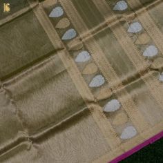 Khinkhwab brings you an exclusive Saree range- specially crafted for Khinkhwab by our weavers for the festive season. This is an exclusive limited edition in Silk and tissue fabrics with an elaborately crafted zari border. The combination of both silk and tissue fabrics makes it a stunning piece. A must buy saree for the festive season. Fabric: Silk by Tissue Weave- Banarasi Golden and silver zari work with zari border. Blouse- Plain with zari border Note- There may be slight color variations du Celebration Tissue Silk Saree With Zari Weaving, Tissue Silk Saree For Celebration And Transitional Seasons, Traditional Tissue Silk Wear For Celebration, Celebration Traditional Wear In Tissue Silk, Celebration Dupatta With Zari Weaving On Tissue Silk, Celebration Tissue Silk Dupatta With Zari Weaving, Green Tissue Silk Dupatta For Celebration, Green Tissue Silk Traditional Wear For Celebration, Diwali Celebration Traditional Wear In Tissue Silk