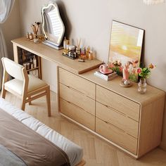 a bedroom scene with focus on the dresser and bed sideboard in the foreground