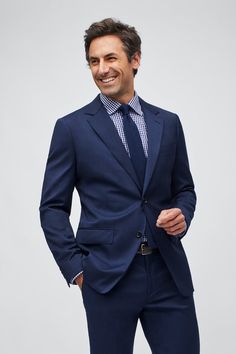 a man in a blue suit and tie