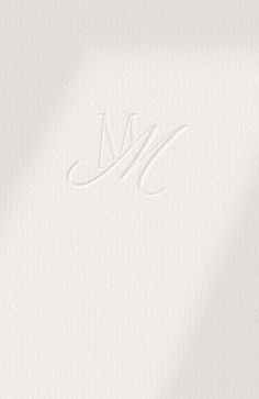 the letter m is shown in white paper