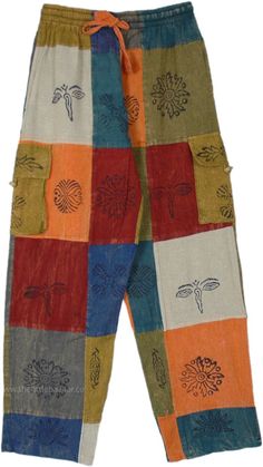 A beautiful pair of bright open-leg multi-color pants, a unique hippie statement piece to add to your wardrobe.  These hippie pants have a nice assorted set of stamps (Om, Ganesha, Eye of Budha, etc) that increase their hippie quotient, dominated with orange, blue, and shades of green. #tlb #SplitSkirtsPants #Patchwork #Stonewash #Yoga #Striped #bohemianfashion #CottonHippiePatchworkPants Hippie Bottoms With Pockets For Festivals, Multicolor Festival Bottoms With Pockets, Multicolor Hippie Harem Pants With Pockets, Hippie Multicolor Harem Pants With Pockets, Hippie Multicolor Pants With Pockets, Colorful Bohemian Cotton Bottoms, Bohemian Orange Cotton Bottoms, Orange Bohemian Cotton Bottoms, Orange Cotton Patchwork Bottoms