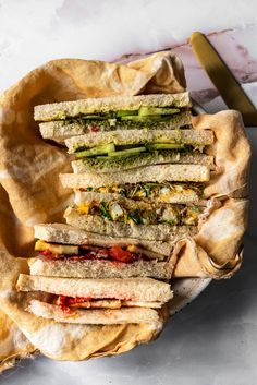 a plate filled with sandwiches on top of a table