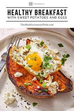 a white plate topped with baked potatoes and an egg