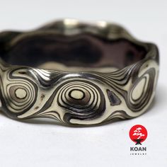 "These are unique mokume gane forged wedding or engagement rings, made of 14K white gold and sterling silver (oxidized). Can be ordered in pair as well as separatly up to your preferences in size, width, thikness and design. They are 100% handmade forged. The price will depend on final weight of the rings.  Koan mokume gane jewellery My name is Andrew Seginovich, designer, maker and creator of Koan Mokume gane Jewelry. Welcome to my shop! The studio was created in 2005, and since that time I've Mokume Gane, Textured Ring, Etsy Wedding Rings, Minimalist Jewelry, Custom Rings, Unique Rings, Cute Jewelry, Ring Verlobung, Metal Working