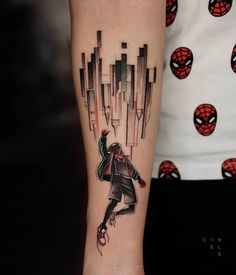 a person with a spider man tattoo on their arm