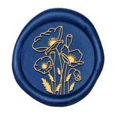 a blue and gold plate with flowers on it