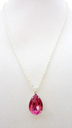 Fuchsia Necklace Hot pink Necklace Rose Zircon Necklace October Birthstone Pendant Bridesmaids Wedding NecklaceA beautiful vintage style shimmering teardrop Rose Zircon fuchsia jewel is attached to a silver setting and hung on a silver box chain to create this vintage estate style gem. The jewel is 18x13 mm and a gorgeous fiery fathomless color which gives rich hints of a profound velvety magenta. It shimmers with an ethereal beauty and would enhance any special occasion or can even be worn from Hot Pink Necklace Jewelry, Hot Pink Necklace, Hot Pink Jewelry, Castle Movie, Fuchsia Necklace, Dr Wardrobe, Necklace Outfit, Apple Varieties, Zircon Necklace