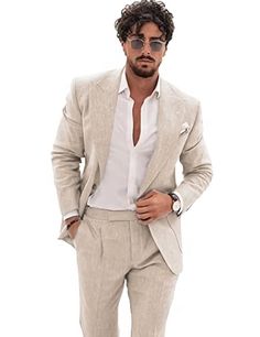 a man in a suit and sunglasses is posing for the camera with his hands on his hips