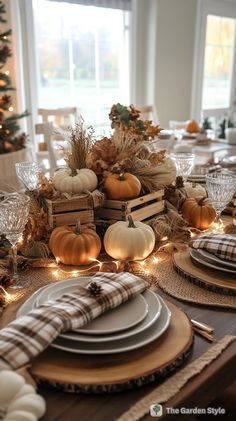 a dining room table set for thanksgiving dinner