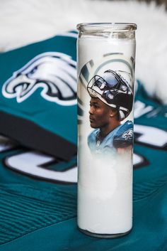 a glass with a photo of a football player on it