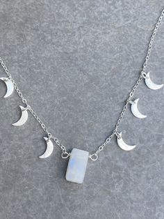 "Moonstone intensifies your feminine goddess energy within. Moonstone is used as a stone of the moon to call in abundance every day. Abundance is always here. The crescent moon means 'to bring forth'. A powerful duo of moon symbols, this necklace channels your divine feminine. I dreamed about this necklace and now, here it is. You can't take your eye off her. She dances as you move, all her little moons sparkling and shining as you spread your light. Wear it and channel abundance in every moment Mystical Moonstone Necklaces For Meditation, Mystical Moonstone Necklace For Meditation, Magical Moon Phase Necklace, White Moon Shaped Mystical Necklace, Mystical Moon Shaped White Necklace, Mystical White Moon Necklace, Mystical White Moon-shaped Necklace, Celestial Moon Phase Crystal Necklaces, Spiritual Moonstone Jewelry With Moon Phase Design