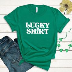 Show your spirit this St. Patrick's Day with this Lucky Shirt funny Irish shamrock shirt! These Bella Canvas unisex tees are perfect for St. Paddy's day parades and festivities! Green Funny Shirt With Screen Print, Funny Green Shirt With Screen Print, Green Funny Print Graphic Tee Shirt, Green Crew Neck Shirt With Funny Text, Graphic Tee Shirt With Funny Print For Fans, Fan Merchandise Graphic Tee With Funny Print, Funny Text Graphic Tee Fan Merchandise, St. Patrick's Day Graphic Print Crew Neck Top, St. Patrick's Day Graphic T-shirt