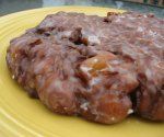 a close up of a doughnut on a yellow plate