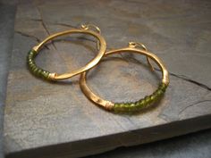 Crescent hoop earrings with olive green idocrase  by ElfiRoose, $75.00 Wire Wrapped Brass Hoop Jewelry, Faceted Round Brass Jewelry, Green Wire-wrapped Hoop Earrings, Green Wire Wrapped Hoop Earrings, Green Brass Hoop Earrings, Wire Wrapped Circle Jewelry, Everyday Wire Wrapped Round Bead Jewelry, Everyday Wire Wrapped Circular Jewelry, Everyday Circular Wire Wrapped Jewelry