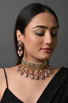 Indian Bridal Jewelry Set, Bridal Necklace Choker Earring Set, Meenakari Statement Necklace, Kundan Jewelry Set, Bollywood Evening Jewelry The majestically handcrafted Kundan necklace set is the best match to the Indian tradition and intricate work handcrafted by the artisans of India. The Kundan set is a masterpiece inspired by Sabyasachi jewelry to give you a royal look. The bold and bright design of the necklace is perfect for all the beautiful women * Necklace Length: Choker (comes with adjustable dori) * Earrings Length: 1.5 inches approx * Material: Brass and stone * Package: Necklace and earrings * Color: Choose from the drop-down menu STYLE TIP: This piece of elegant jewelry goes well with all your modern as well as traditional outfits. Best match for your wedding outfits ABOUT US: Traditional Ceremonial Kundan Necklace With Meenakari, Festive Meenakari Bridal Set For Reception, Ceremonial Kundan Necklace With Motifs, Ceremonial Red Meenakari Jhumkas, Meenakari Bridal Sets For Reception And Diwali, Bollywood Style Ceremonial Kundan Necklace With Motifs, Ceremonial Kundan Chandbali Necklace With Motifs, Ceremonial Chandbali Kundan Necklace With Motifs, Gold Traditional Wear With Motifs For Reception