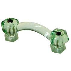 a green glass door handle with two black knobs on each side and an oval hole in the middle