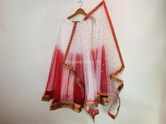 This is a made to order Lehenga Choli dupatta.  I make it exclusively for my customers by using designer fabrics. I will only make it after you confirm your required size details. Handling time, don't worry, just tell me, I will process it accordingly and deliver on or before a delivery date you mention. Blouse is made with Red Color Velvet fabric and lace border. Dupatta is in sequines Net. The skirt or Lehenga is made with dual shade net fabric with very good quality lining. Lehenga is made with beautiful borders attached. Traditional Red Anarkali Set With Sheer Dupatta, Red Unstitched Organza Sharara, Fitted Red Lehenga With Gota Work, Red Traditional Wear With Sheer Dupatta, Red Semi-stitched Lehenga With Gota Work, Fitted Red Anarkali Set With Cutdana, Red Sharara With Dori Work And Traditional Drape, Fitted Red Sharara With Gota Work, Fitted Red Chanderi Sharara