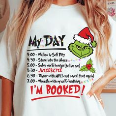 a woman wearing a t - shirt with the grin face on it that says, my day