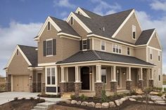 a large house with lots of windows and landscaping