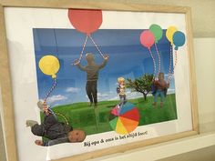 there is a framed photo with balloons on it