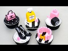 six cupcakes with different designs and colors on them, all decorated to look like women's purses