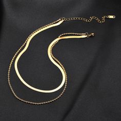 This totally twisted necklace is 18K gold plated perfection! Our Double Layer Twists Snake Bone Chain Necklace is the perfect way to add a little serpentine style to your wardrobe. Get ready to slither in style! Made of No-tarnish medical-grade titanium Made to order: Please allow 5-10 days to process your order Tarnish-proof Water-proof Create with 18K gold plated Safe for sensitive skin Bracelet Length & weight: 18cm & 28.1g Necklace Length & weight: 45cm & 73g Product keywords: Chain necklace Double Chain Necklace, Double Necklace, Herringbone Necklace, Layered Necklace Set, Trendy Necklaces, Chains Necklaces, Gold Necklace Layered, Chain Choker Necklace, Simple Jewelry