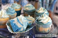 cupcakes with frosting and blue icing on a glass plate