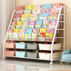 a child's playroom with toys and books on the wall, including storage bins