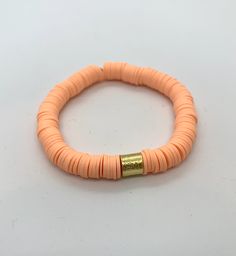 "This listing is for 1 Sherbet Orange Bracelet. Each bracelet is hand-beaded with African clay discs and accented with a brushed gold cylinder bead. The bracelet is made with stretch elastic which makes it comfortable and easy to wear. My bracelets are made to fit an average wrist size of 6.5\"-7\". Take a look around my shop for additional colors to add to your stack! The more the better!" Royal Blue Bracelet, Beads Candy, Orange Bracelet, Candy Stripes, Heishi Beads, Photo Bracelet, Blue Bracelet, Pink Flamingos, Hand Beading