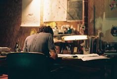 a man sitting at a desk in an office