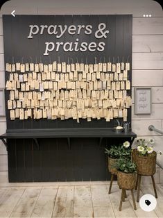 a sign that says prayers and praises with small notes attached to them on clothes pins