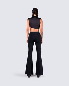 An all-black fit always exudes a "don't mess with me" kind of vibe 😈 Intimidate and entice them all with this 2 piece set, featuring a black turtleneck crop top, paired with black lace-up flared pants 🖤 Black Stretch High Neck Crop Top, High Stretch Black High Neck Crop Top, Black High Stretch Crop Top For Party, Edgy Stretch Crop Top For Evening, Stretch High Neck Crop Top For Party, Black High-waist Crop Top For Night Out, Edgy Fitted High Waist Crop Top, High Waist Stretch Black Crop Top, Edgy High Waist Fitted Crop Top