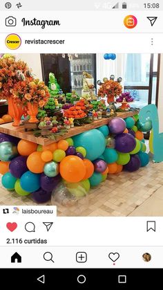 an instagram page with balloons and flowers on the table in front of it, which reads instagram