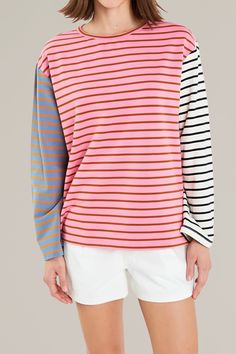 this colorful, pink multicolor long sleeve shirt combines a color block design and striped pattern that effortlessly creates a fun and comfortable top to pair with shorts or jeans. the breathable, soft fabric is perfect for warmer seasons or for laying under an oversize denim jacket. 95% cotton | 5% spandex hand wash cold | iron low | do not tumble dry model is wearing a size small model's measurements: 5'8.5" height, 32" bust, 24" waist, 34" hip Multicolor Horizontal Stripe Tops For Spring, Multicolor Striped Top For Summer, Pink Cotton Top With Contrast Stripes, Multicolor Vertical Striped Tops For Spring, Casual Pink Tops With Contrast Stripes, Multicolor Tops With Contrast Stripes For Spring, Multicolor Long Sleeve Top With Vertical Stripes, Spring Multicolor Vertical Striped Tops, Casual Multicolor Tops With Striped Sleeves