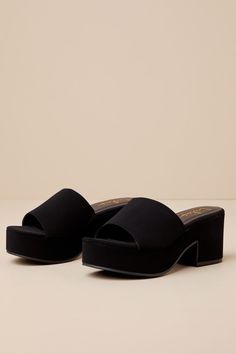 Looking for a go-to shoe for the upcoming season? Then look no further, because the Lulus Belamie Black Suede Platform Slide Sandals will quickly become your fave pair! Super soft faux suede shapes these trendy mules that have an almond-shaped toe bed (atop a 1.25"" toe platform) and a wide vamp strap that creates a peep-toe upper. A chunky block heel lends a comfortable finish to the simple and chic slide-on design! 3" wrapped block heel. Lightly cushioned insole. Rubber sole has nonskid markin Suede Sandals With Block Heel For Night Out, Suede Block Heel Sandals For Night Out, Suede Sandals For Night Out With Open Heel, Suede Sandals With Padded Heel For Night Out, Chic Suede Heels With Cushioned Footbed, Chic Cushioned Suede Heels, Black Suede Sandals With Padded Heel, Black Platform Slide Mules, Black Platform Slip-on Slides