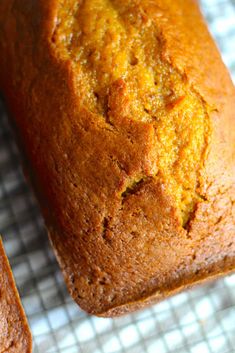 a loaf of bread sitting on top of a cooling rack