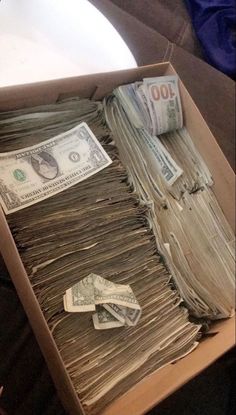 an open box filled with lots of money