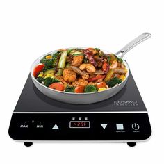 a wok on top of a digital scale with food in it