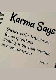 a book with writing on it that says karma says science is the best answer for all questions, smiling is the best reaction in every situation