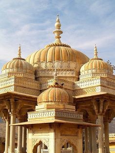 an elaborately designed building in the middle of a desert