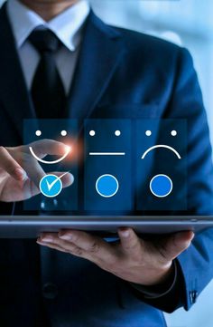 a man in a suit holding a tablet with icons on it