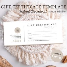 the gift certificate is displayed on top of a table with nuts and cinnamons around it