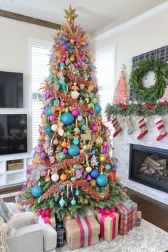 a brightly colored christmas tree in a living room