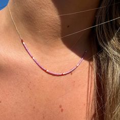 Perfect alone or in layers, tiny color-saturated Japanese micro beads move along a 16" delicate 14k gold chain. These beautiful, vibrant beaded necklaces are designed to add a fun pop of color. Questions? shop@katiediamondjewelry.com Trendy Pink Necklace With Tiny Beads, Pink Dainty Necklace With Beaded Chain, Dainty Pink Beaded Necklaces With Colorful Beads, Dainty Pink Jewelry With Colorful Beads, Dainty Pink Beaded Necklace With Tiny Beads, Pink Tiny Beads Jewelry For Everyday, Pink Round Bead Necklace For Everyday Wear, Pink Round Beads Necklace For Everyday, Minimalist Pink Round Bead Necklaces